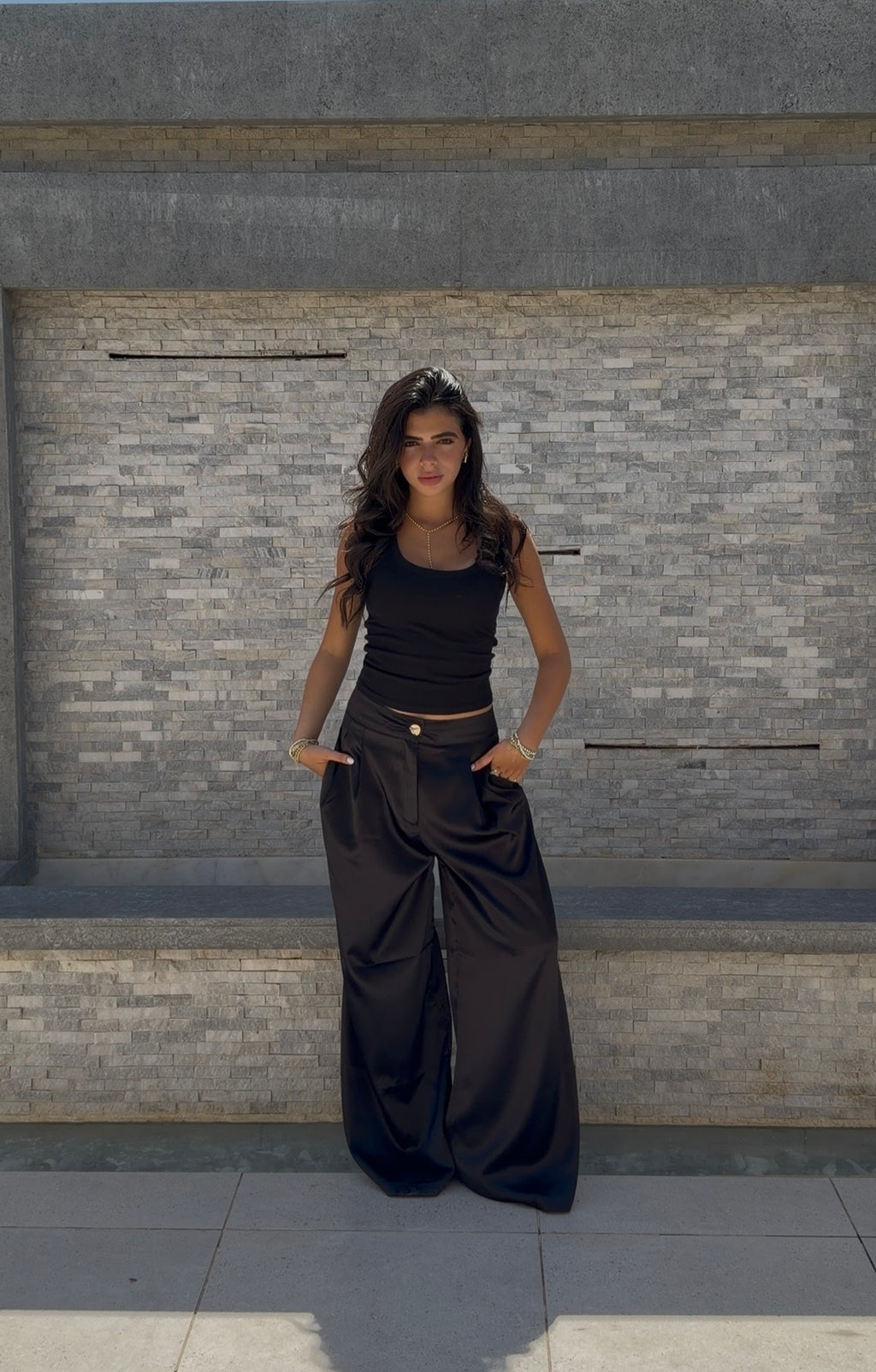 Flowing satin trousers.