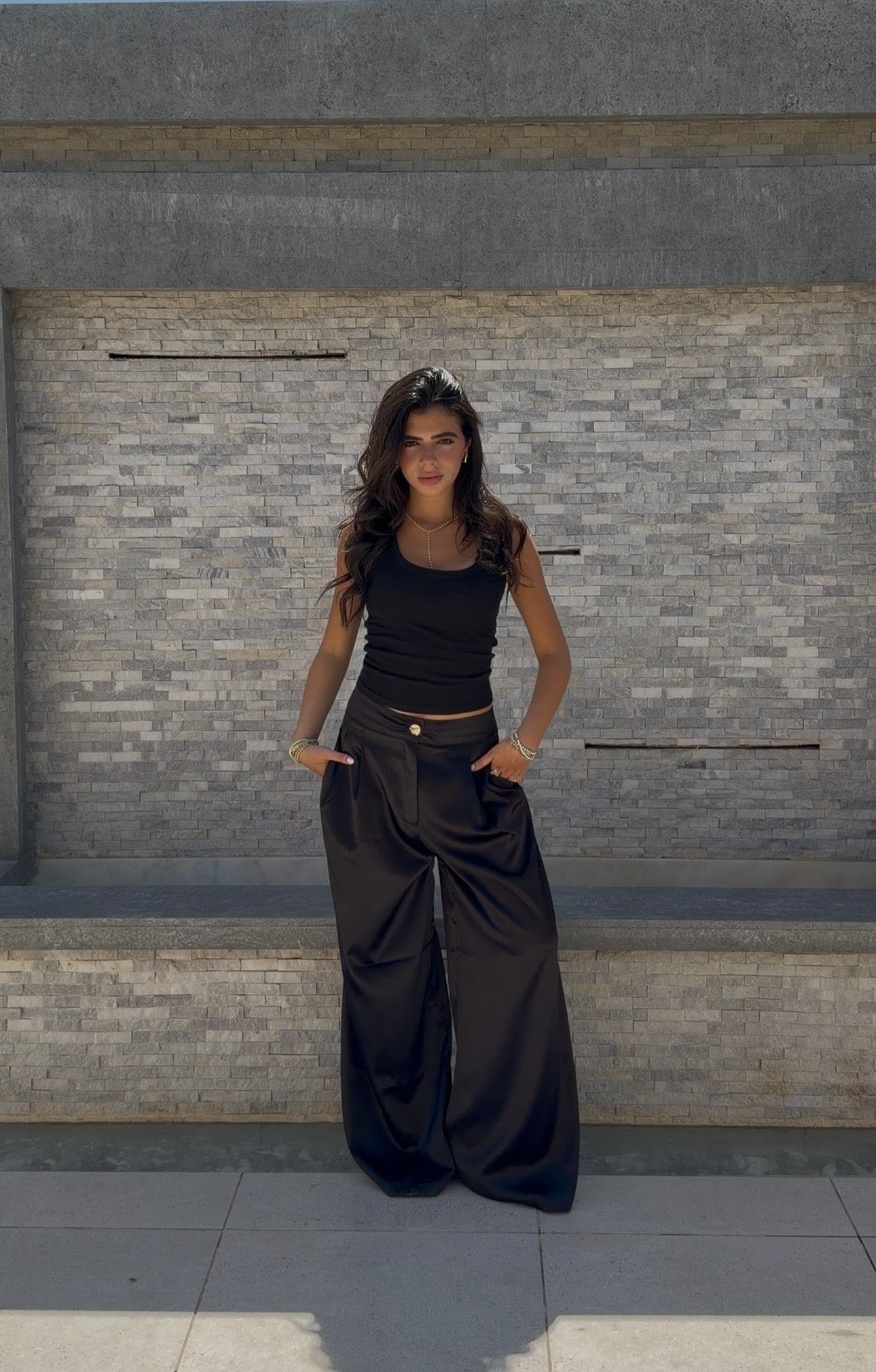 Flowing satin trousers.