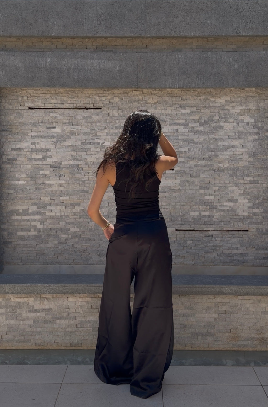 Flowing satin trousers.