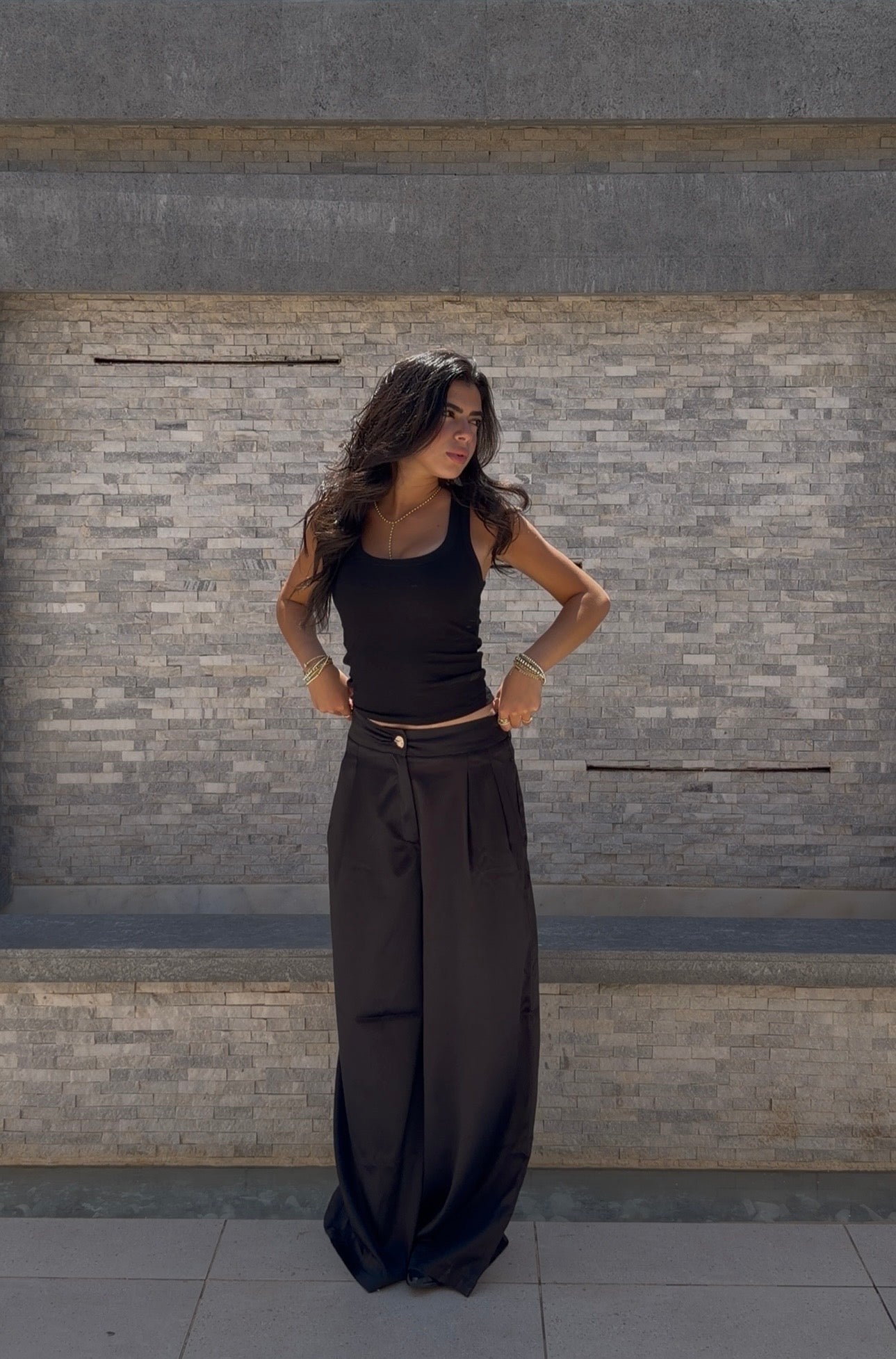 Flowing satin trousers.