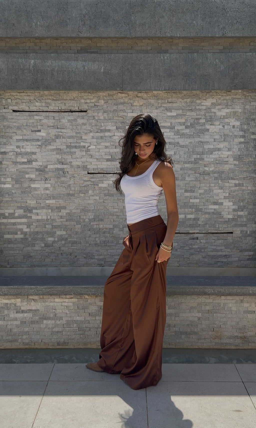 Flowing satin trousers.