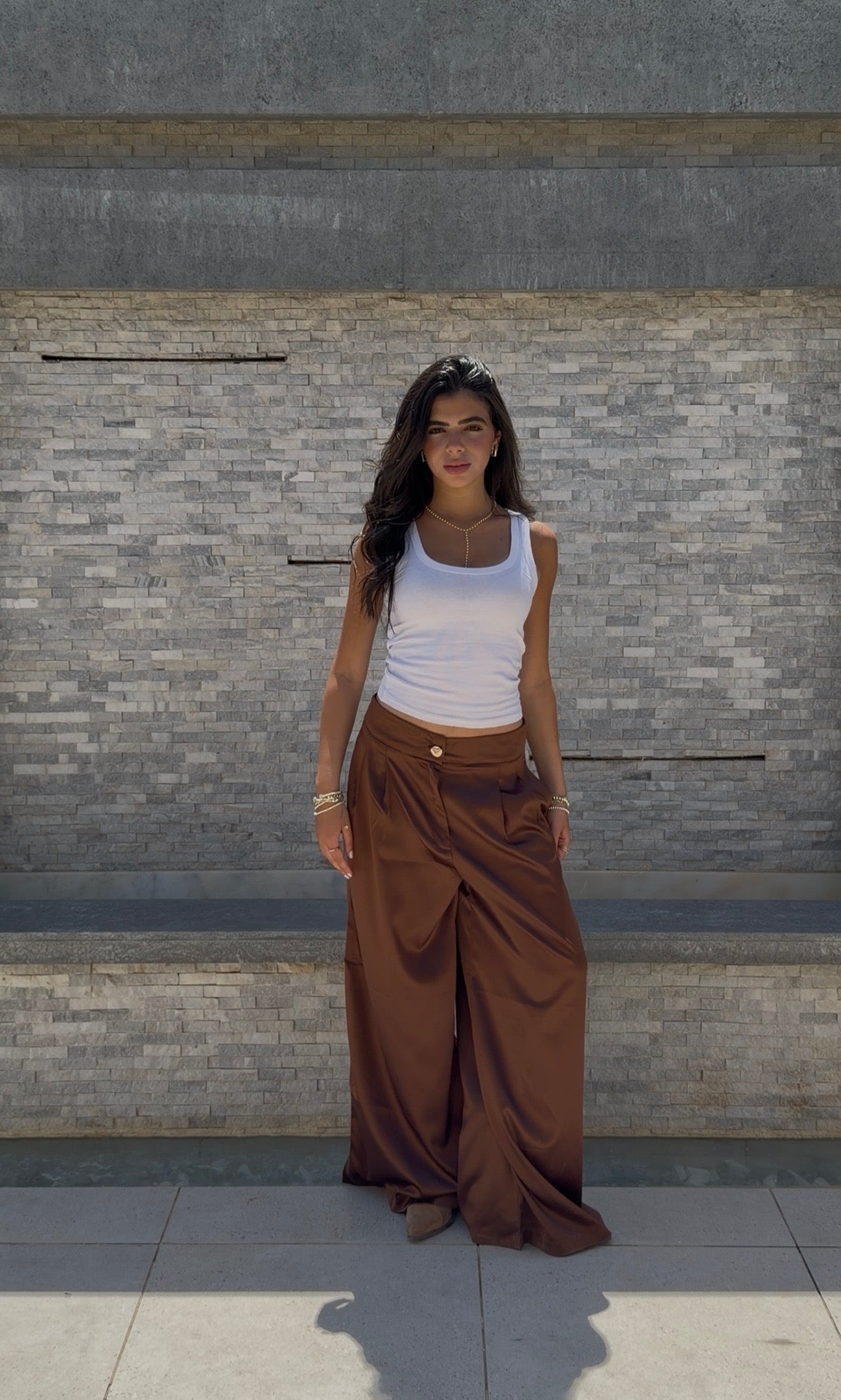 Flowing satin trousers.