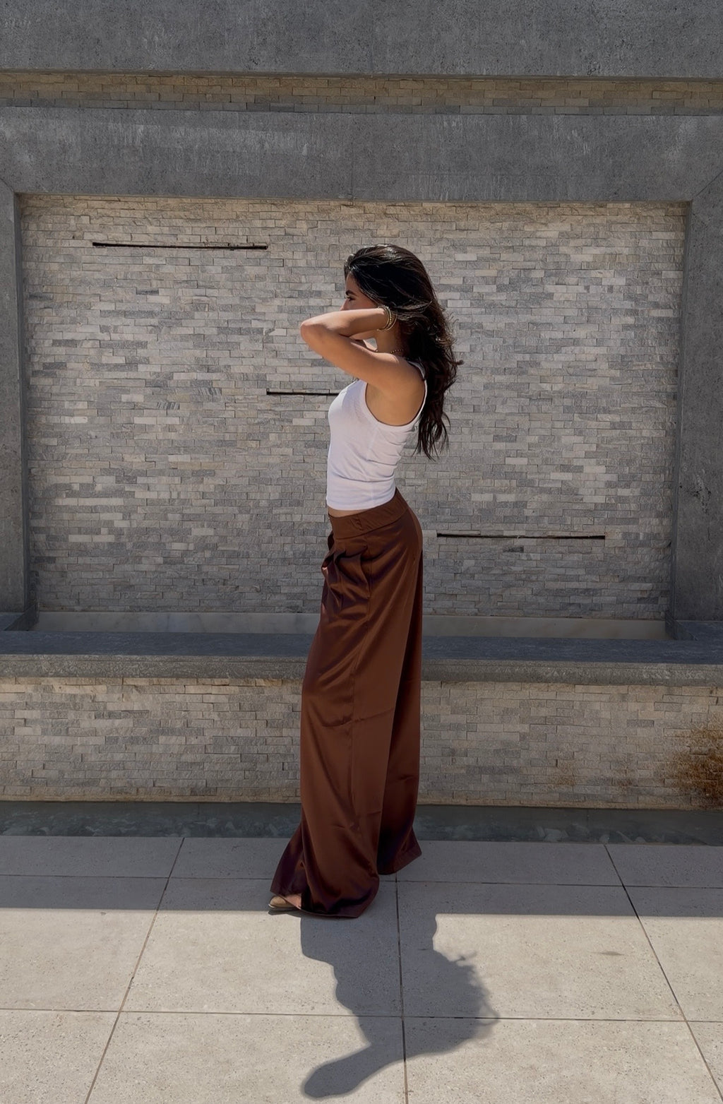 Flowing satin trousers.
