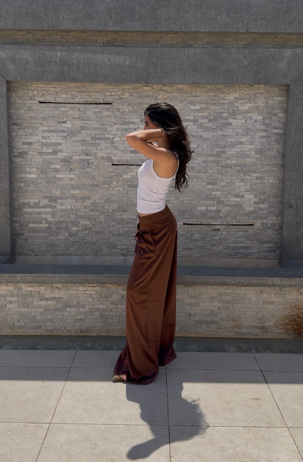 Flowing satin trousers.