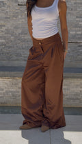 Flowing satin trousers.