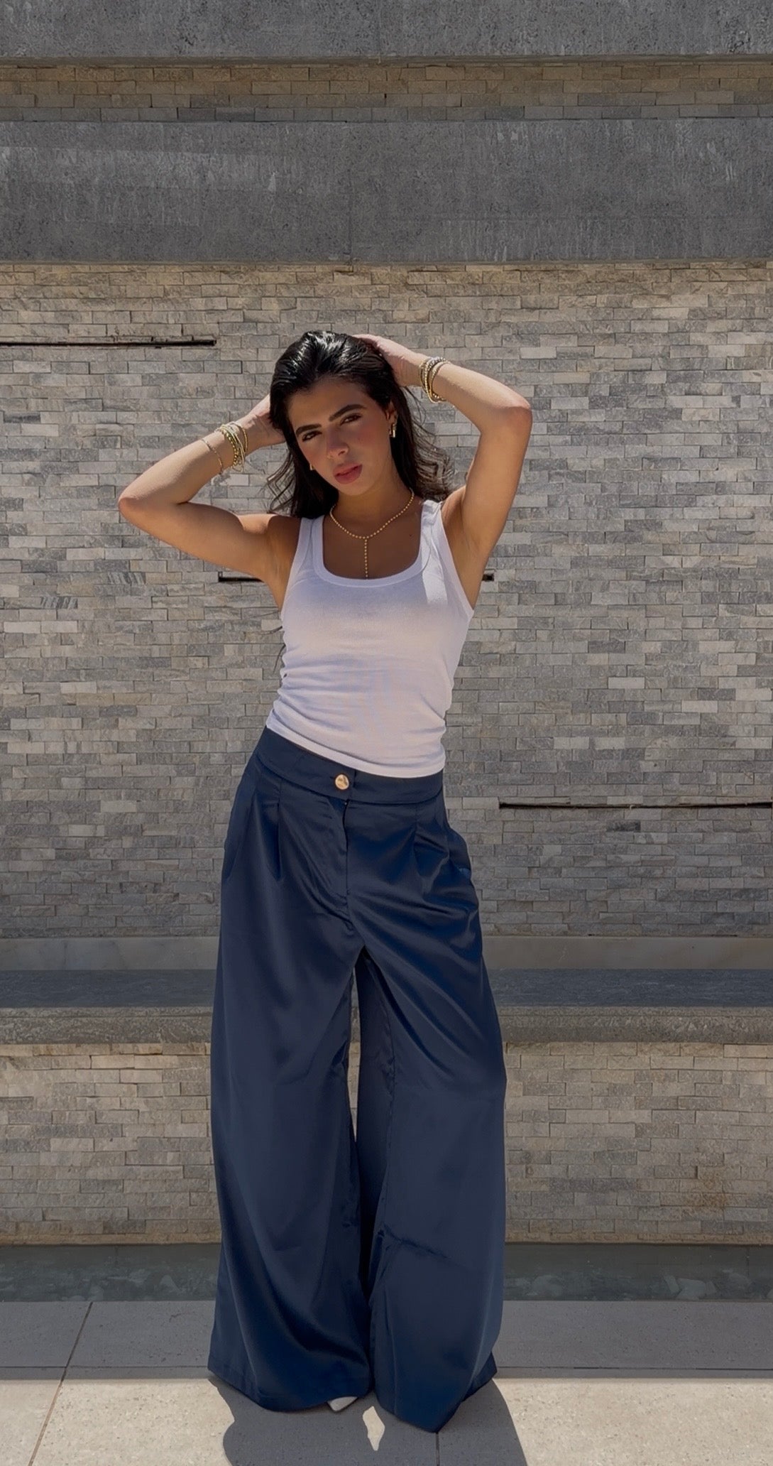 Flowing satin trousers.
