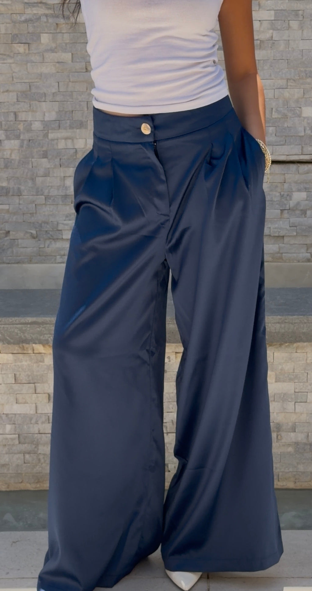 Flowing satin trousers.