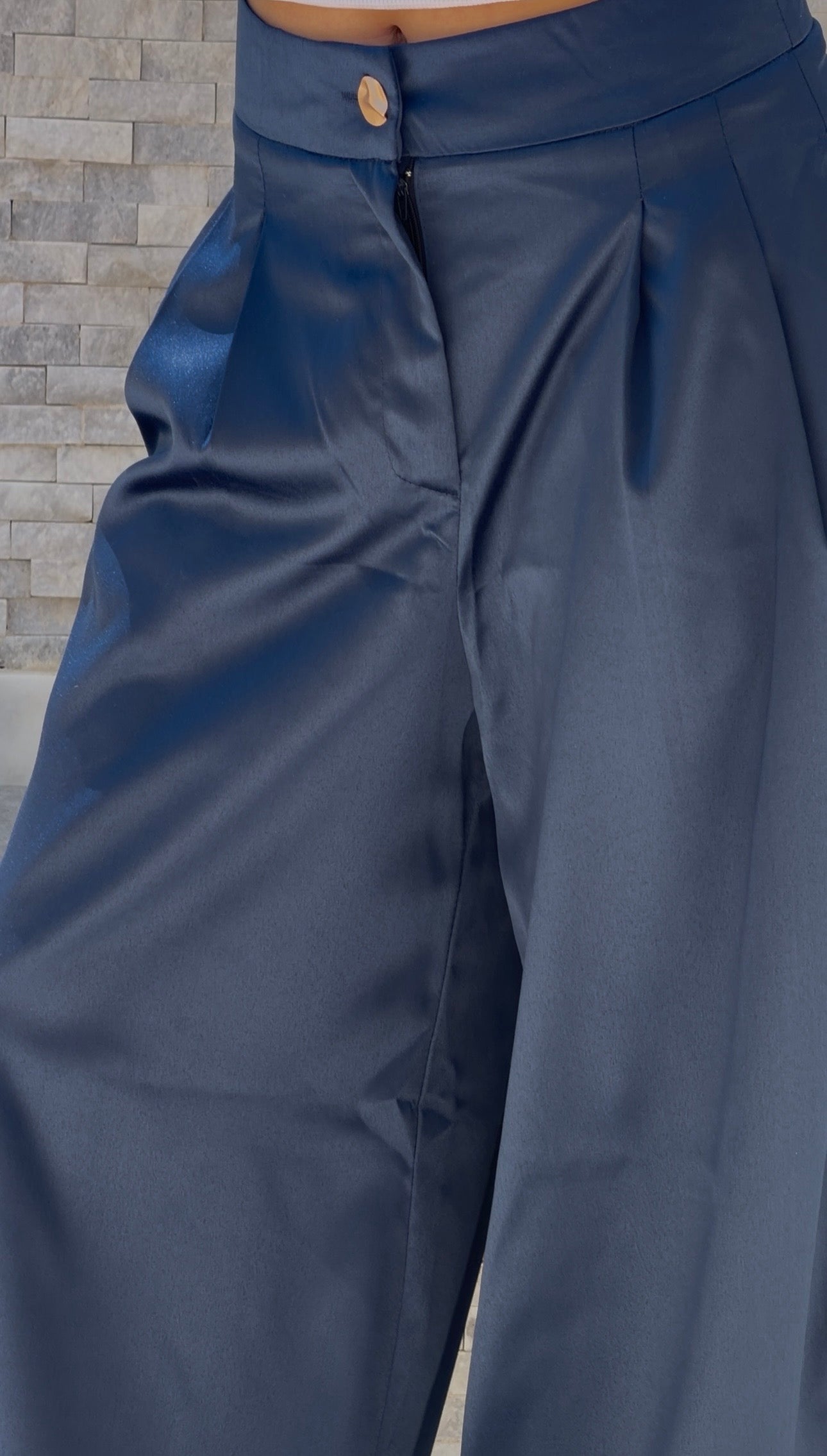 Flowing satin trousers.