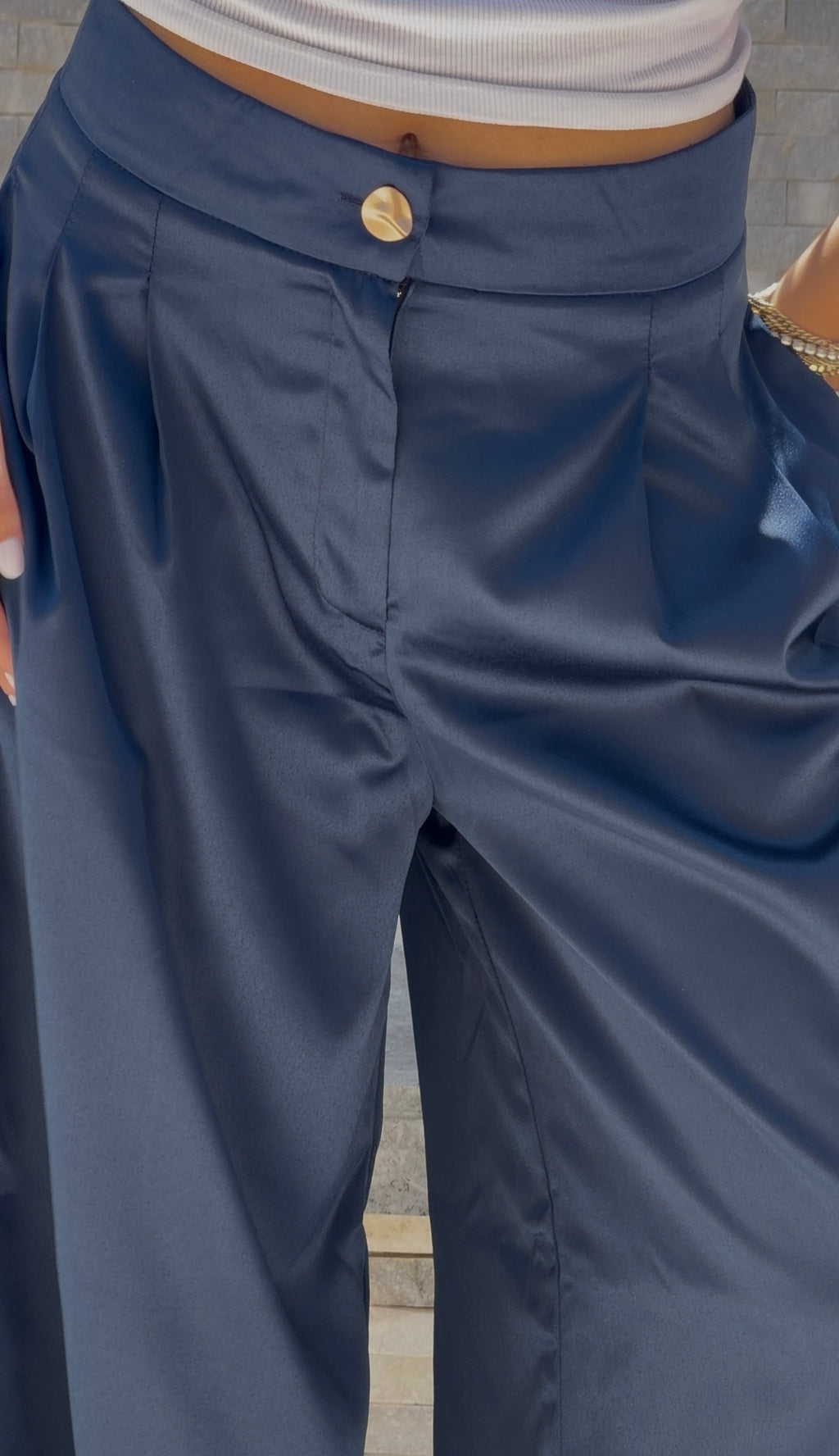 Flowing satin trousers.