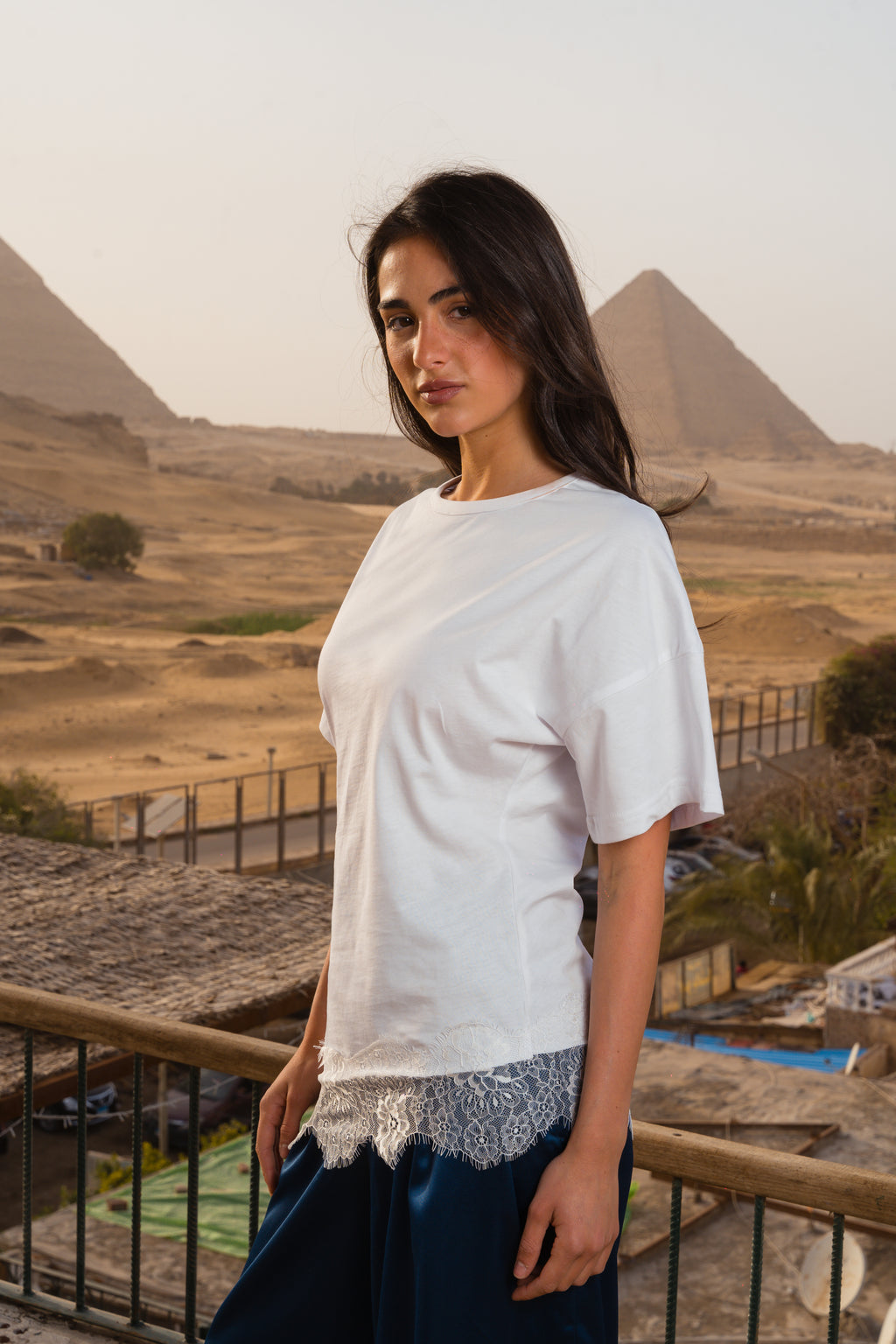 Waist-fitted lace tee.