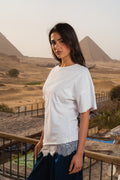 Waist-fitted lace tee.