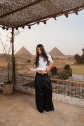 Flowing satin trousers.