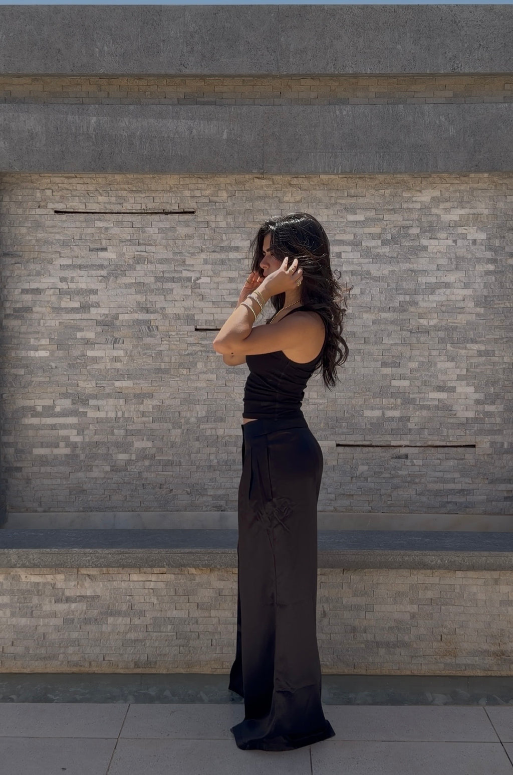 Flowing satin trousers.