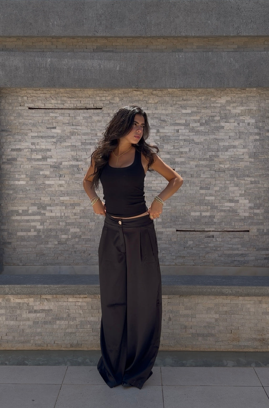 Flowing satin trousers.