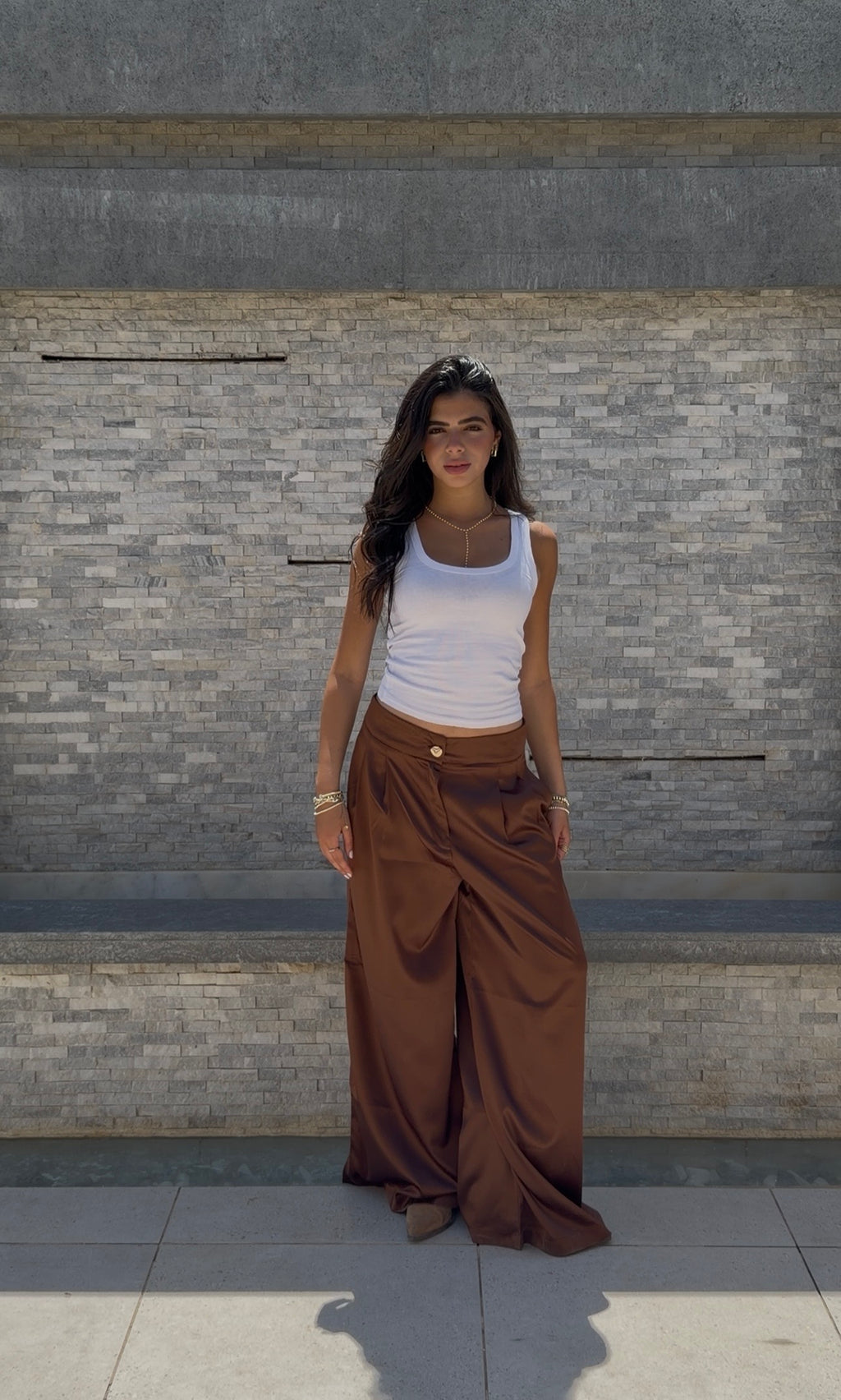 Flowing satin trousers.