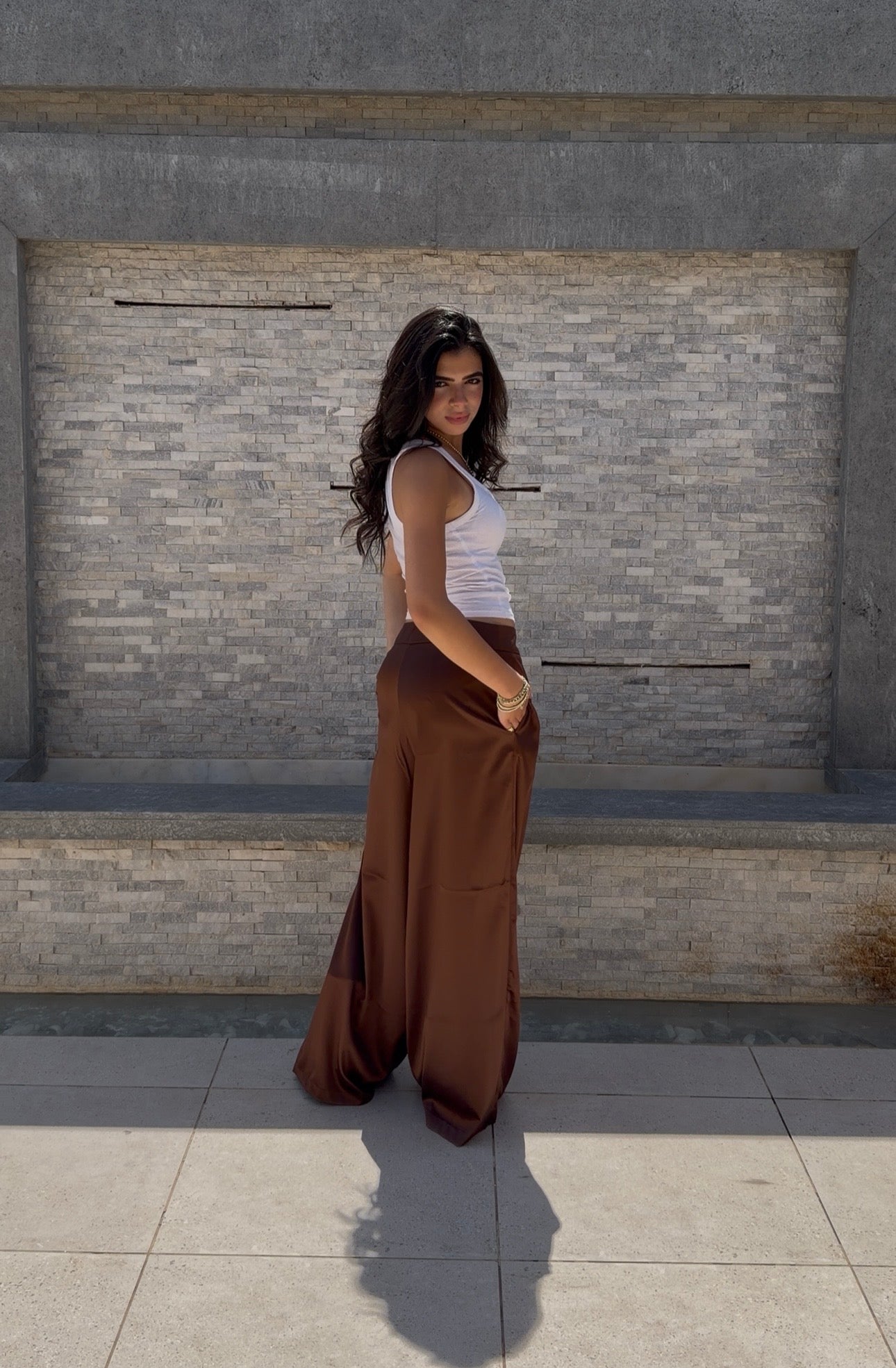 Flowing satin trousers.