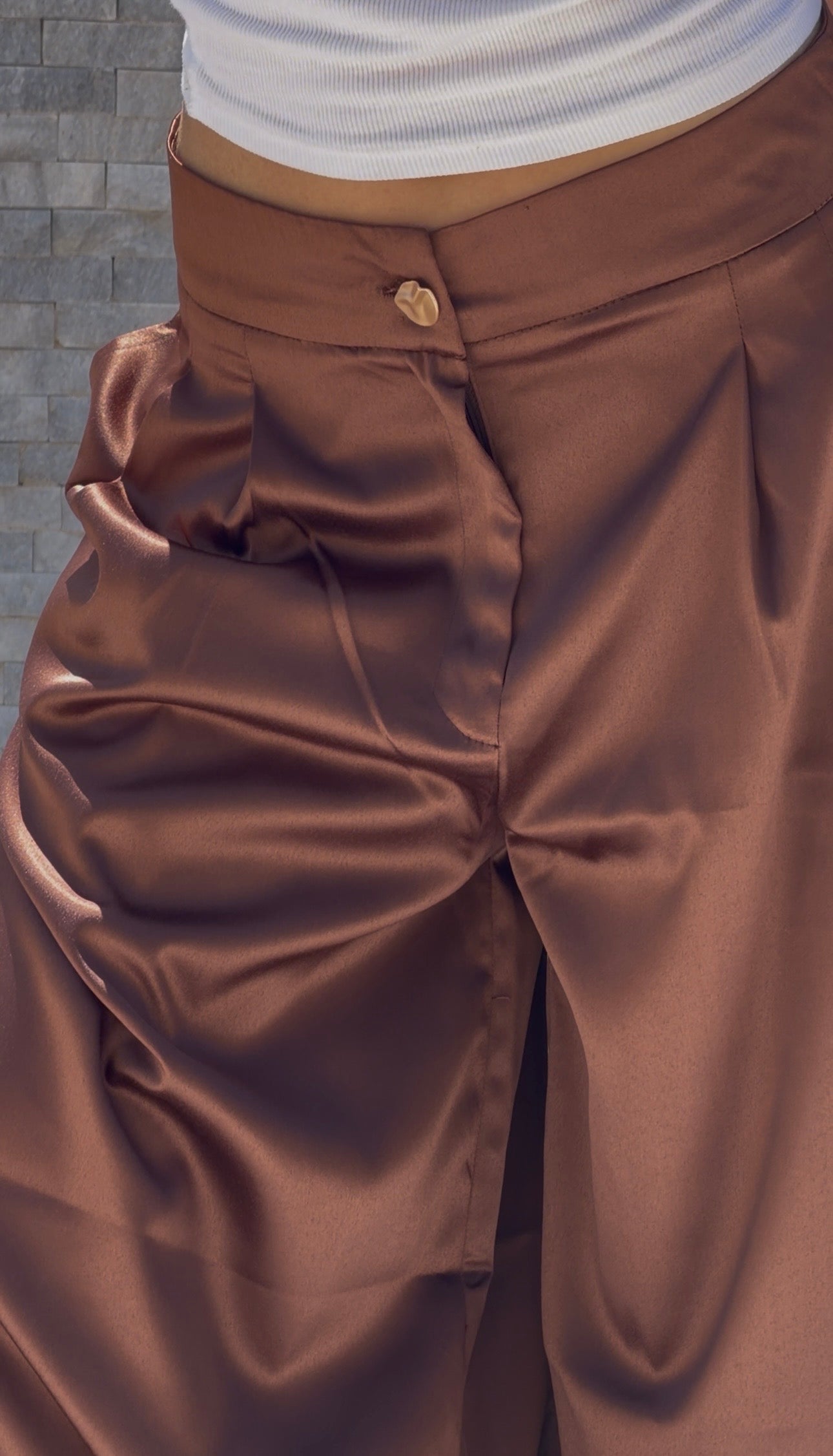 Flowing satin trousers.